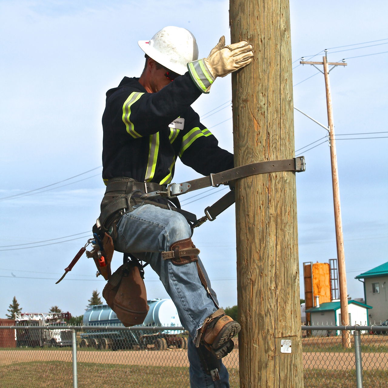 lineman climbs power ple