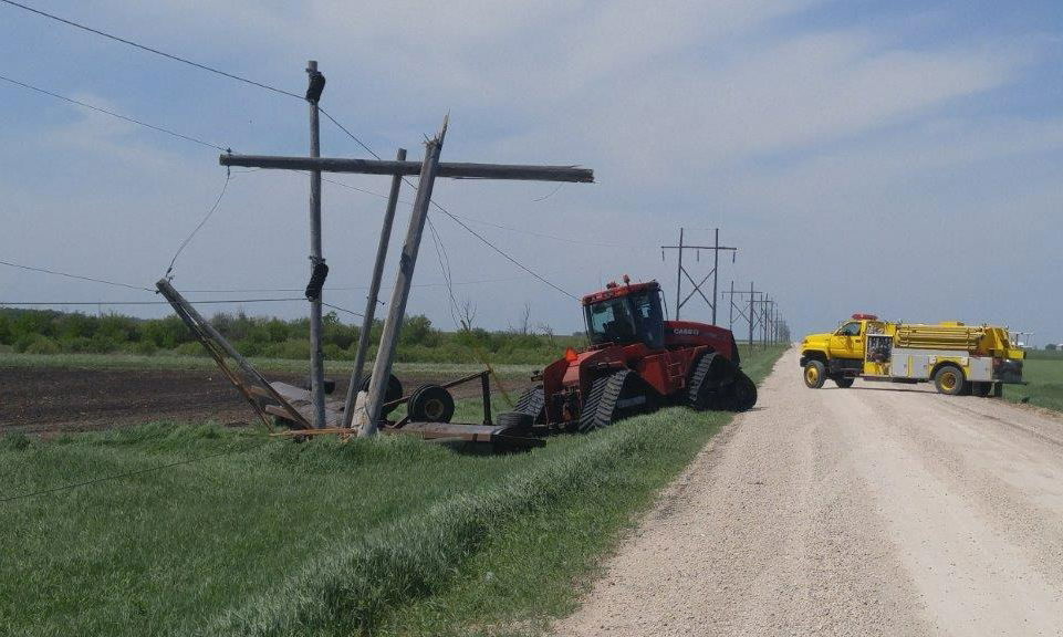 powerline downed by farm tractor